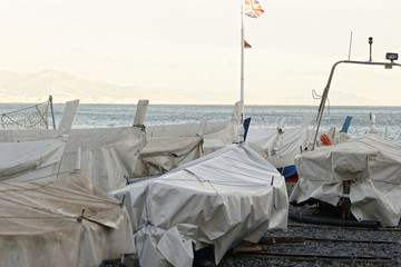 detail of same boats in a beach