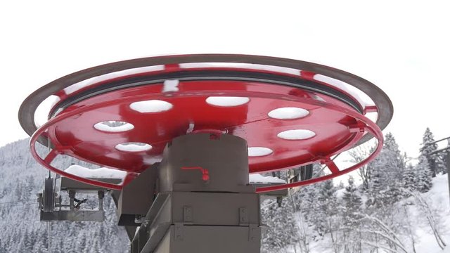 Rotating red flywheel of chairlift