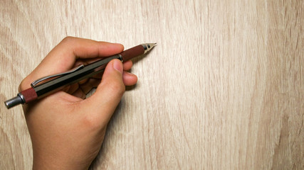 Hand written pencil Wooden background