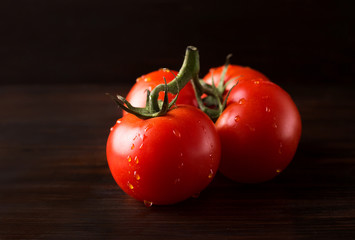 Tomatoes on a dark background