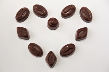 Chocolate candy hearts on a white background 