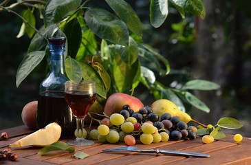 Wine and grapes on a wooden table