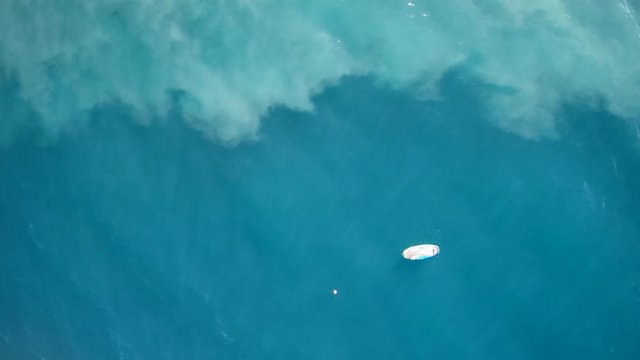 Surfboard on the water - by Drone