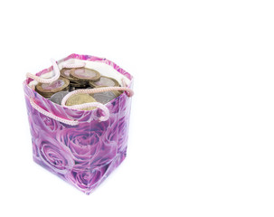 a stack of banknotes and a bag of coins  