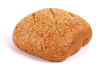 Round rye bread covered with sesame seeds