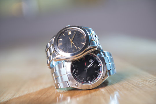 Beautiful stainless steel watches stack one on top of other.