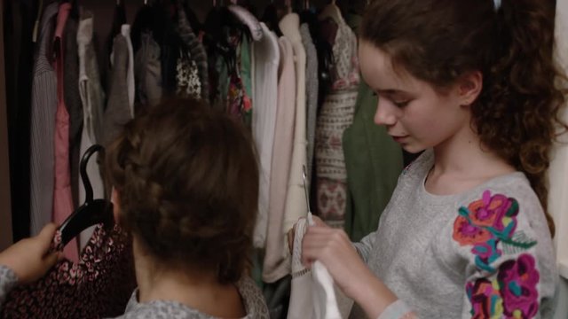 Sisters Sharing Clothes