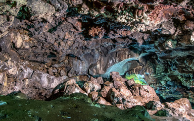 Beautiful view of cave wall in cave passage, showing detail of the rock texture, illuminated by lamp,  Captured from Lawa cave, Purbalingga, Indonesia. © Adnan