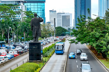 View of  modern skyscraper buildings and public transport bus  in front of general Soedirman...