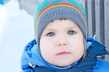 Little girl portrait face outdoor at winter