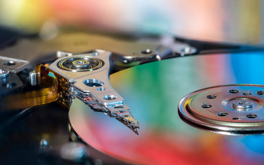 Beautiful photo of inside of harddisk, as symbol of computer storage. Showing harddisk's colorful...