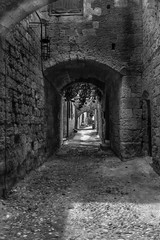  Pebbled dark street in Rhodes, Greece