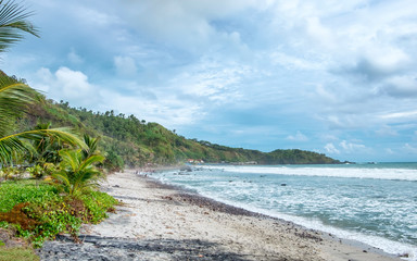 Beautiful tropical beach in cloudy day, with no people in it.   Captured on Menganti Beach, Kebumen, Indonesia