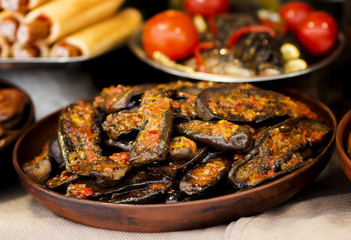 stuffed baked aubergines in pottery