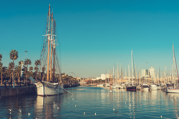 Fototapeta na wymiar sailing boat on barcelona harbor at sunny day