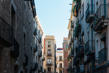 Fototapeta na wymiar historical street with apartment houses at barcelona
