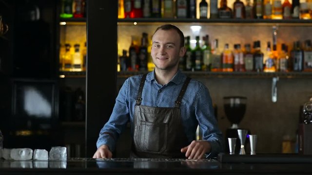 Portrait of a bartender at the bar