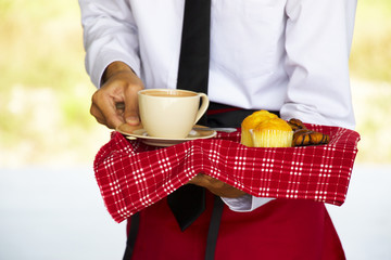 waiter is serving coffee 