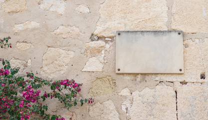 plaque and flowers on the wall