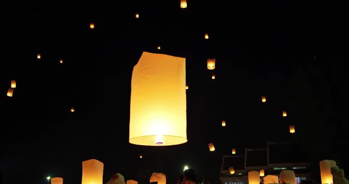 Floating lanterns in night sky celebration at Yi Peng Festival. Chiangmai, Thailand.