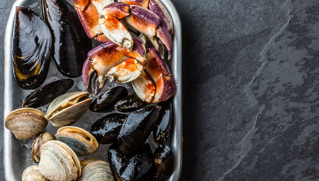 Uncooked fresh seafood Mussels, Clams, Vongole and Crabs
