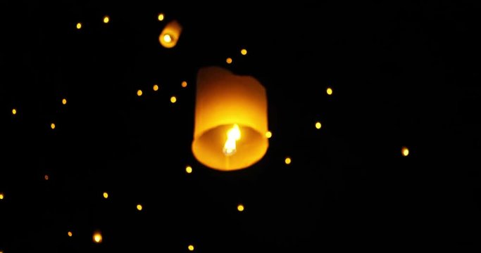 Floating lanterns in night sky celebration at Yi Peng Festival. Chiangmai, Thailand.