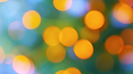 Obraz premium Abstract blur city rush green yellow purple bokeh light background. Horizontal defocused image, copy space.