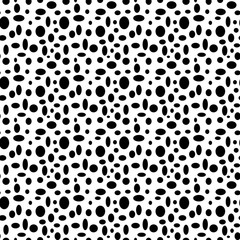 Seamless white pattern with black polka dots in different sizes as a background - Eps10 vector graphics and illustration