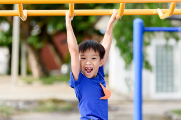 Fototapeta premium Young boy play with yellow bar