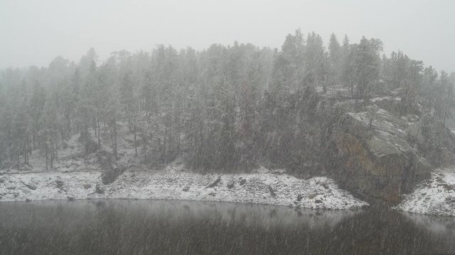 The First Snow Falls onto Warm Ground