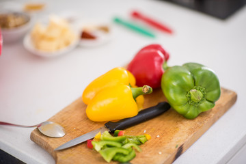 Preparing food in modern white kitchen