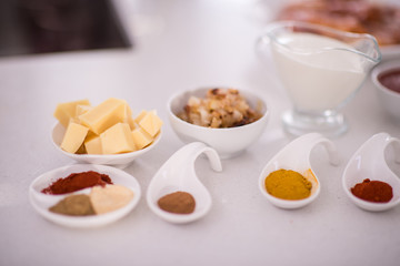 Preparing food in modern white kitchen