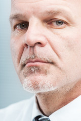 mature business man closeup trustworthy portrait