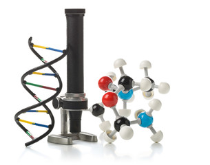 Chemical molecule and DNA structure model with old microscope ov
