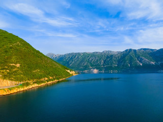 Fototapeta na wymiar The road on coast of Boka Kotor bay in Montenegro