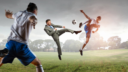 Obraz na płótnie Canvas Soccer player kicking ball . Mixed media