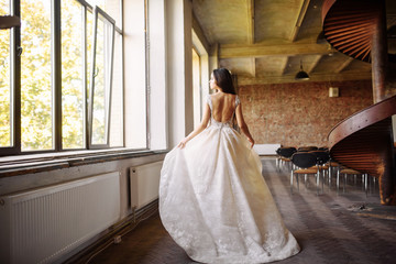 Bride in wedding dress at luxurious studies