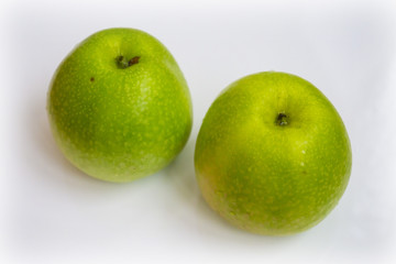 Fresh green apple fruits on white background