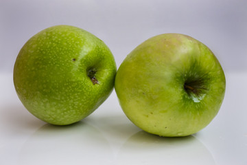 Fresh green apple fruits on white background