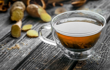 still life with transparent Cup of tea on wooden background