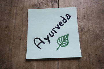 Post it memo on wooden table, Ayurveda