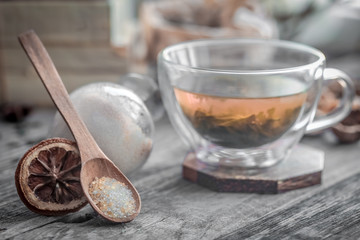 still life with transparent Cup of tea on wooden background