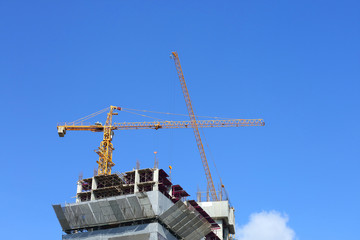 machinery crane working in construction site building