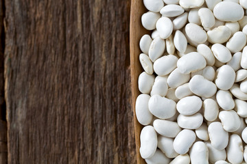 white butter beans on wooden surface