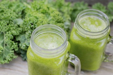 Nutritional smoothie of fresh organic curly green kale with tang