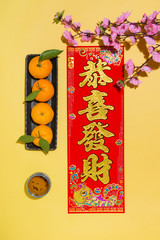Chinese new year decoration items on yellow background.