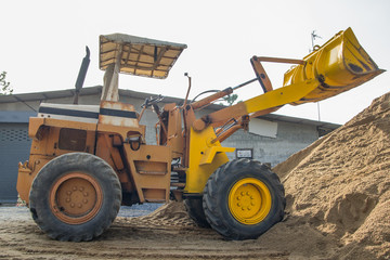 yellow tractoe back hoe