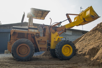 yellow tractoe back hoe