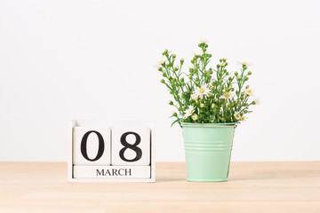March 8 Calendar Wooden Cube on Table. Valentine's Day