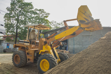 Fototapeta premium yellow tractoe back hoe